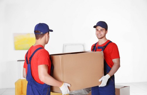 Commercial office items prepared for transport by moving truck in Paddington
