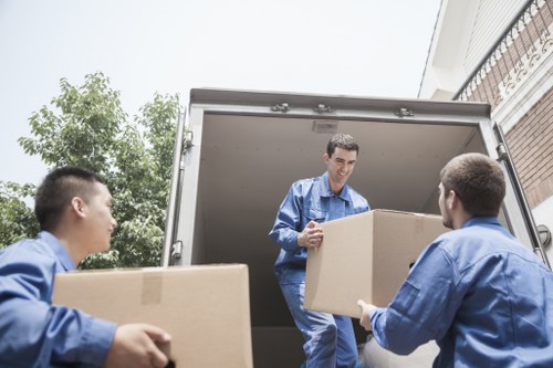 Packed moving boxes and furniture ready for transport in Paddington