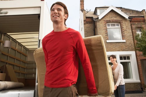 Safe loading of a grand piano using professional moving equipment