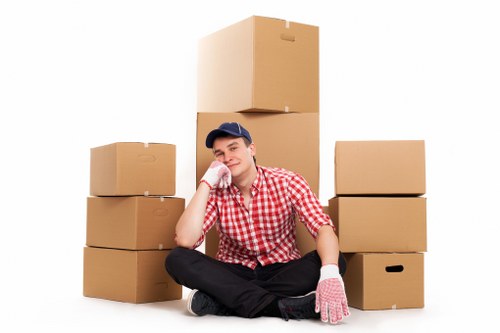 Worker using equipment to handle a heavy item safely